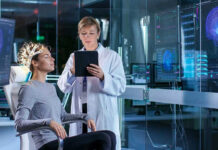 Scientist monitoring brain activity of a patient
