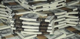 Piles of bundled cash stacked together