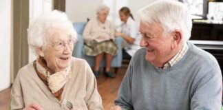 Elderly couple enjoying a meal together in a dining room