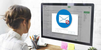 Person viewing email error on desktop computer screen