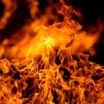 Close up of vibrant flames against a dark background