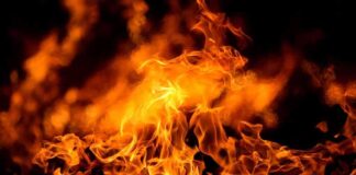 Close up of vibrant flames against a dark background