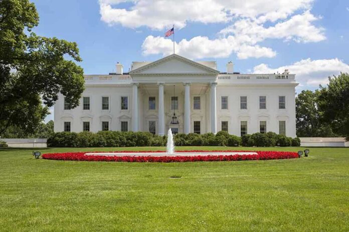 The White House with a fountain and flower beds in front