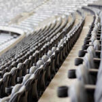Athletes’ Bold Stand Ignites National Firestorm Empty rows of gray seats in a stadium