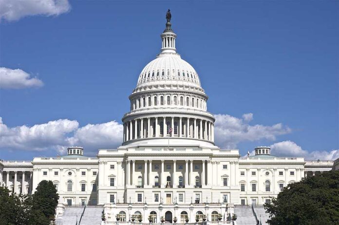 The US Capitol building under a clear blue sky