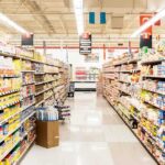 A grocery store aisle filled with various food products on shelves