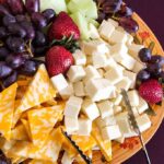 Metal Fragments Found — 1.5M Bags A colorful cheese and fruit platter featuring various cheeses and fresh fruits