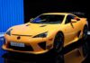A bright yellow Lexus LFA sports car displayed at an exhibition