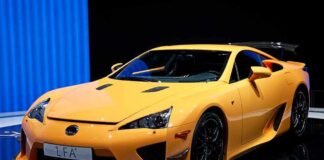 A bright yellow Lexus LFA sports car displayed at an exhibition