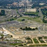 Aerial view of the Pentagon surrounded by highways and urban areas