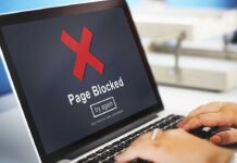 Wall Street SHOCKED: Trump BLOCKS THEM Laptop screen displaying a 'Page Blocked' error message