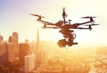 Drones Invade America — 40 Million Targeted A drone flying over a city skyline during sunset