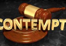 A wooden gavel resting on a circular base with the word CONTEMPT in gold letters
