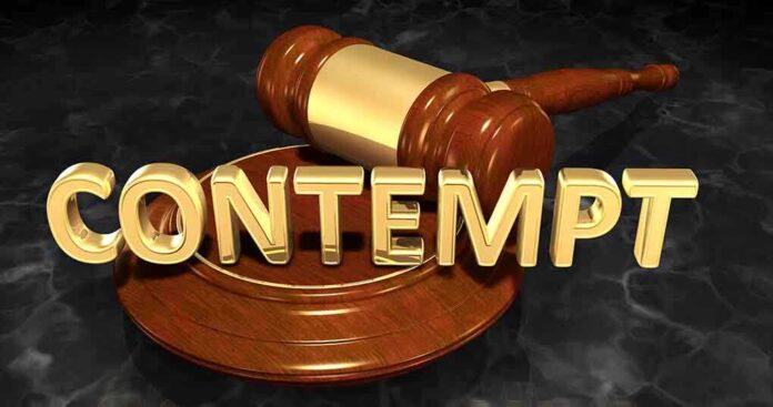 shutterstock_658691773 (1).jpg A wooden gavel resting on a circular base with the word CONTEMPT in gold letters