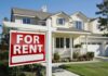 A house with a For Rent sign in the front yard
