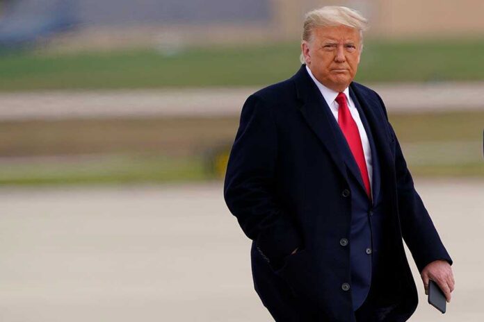 shutterstock_1876973395.jpg Donald Trump walking outdoors in formal attire