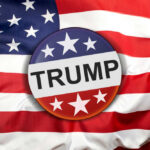 Button with Trump on American flag.