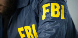 FBI jacket with yellow letters.