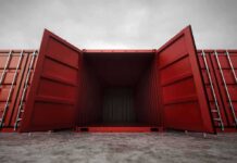 Open red shipping container with a view into the empty interior