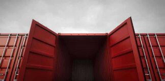 Open red shipping container with a view into the empty interior