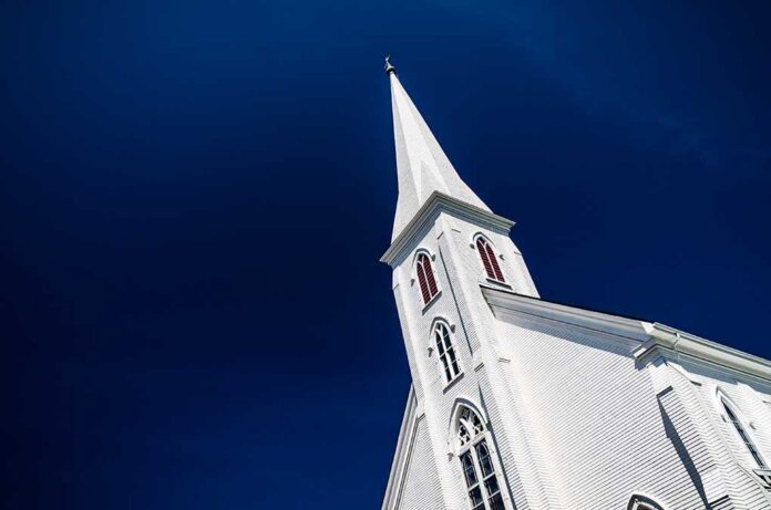 A tall church steeple against a clear blue sky