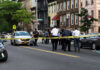 Inside the Philadelphia House That Has the FBI on Alert Police gathered at an urban crime scene.