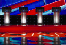 Endorsement Power Tested in Primaries Four debate podiums on a CNN stage background.