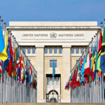 Middle East Conflict Near “Breaking Point,” UN Warns United Nations building with numerous national flags outside.