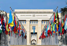 Middle East Conflict Near “Breaking Point,” UN Warns United Nations building with numerous national flags outside.