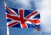 British flag waving against a blue sky