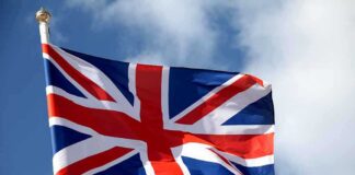 British flag waving against a blue sky