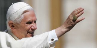 Pope Benedict XVI smiling and waving during a public appearance
