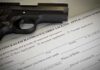 Five Years, Three Lawsuits, One Rifle Finally Returned A handgun placed on top of a concealed carry license application form