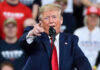 Supreme Court Smacks Trump — Chaos Ensues Man in suit pointing, speaking at a rally.