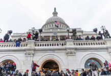 Crowd gathered on steps of Capitol building.