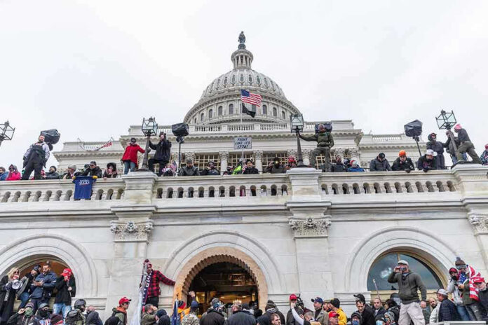 Crowd gathered on steps of Capitol building.