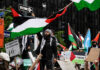 The One Issue Breaking Washington’s Old Israel Consensus Protesters with flags and signs, one holding a megaphone.