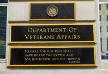 A Faster Path to Psychedelic Treatment Leaves Millions Waiting Department of Veterans Affairs building sign with quote.