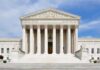 Supreme Court Draws the Line on Birthright Citizenship Front view of the Supreme Court building with large columns and steps under a blue sky