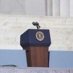 Biden’s July 4 ‘Unity’ Message Reignites Autopen Controversy Podium with a microphone and presidential seal in front of steps