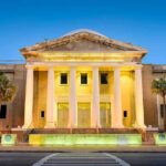 Federal Agent Accused in Violent Hazing That Nearly Killed Two Supreme Court building with illuminated columns at dusk