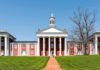 DOJ Takes On 12 States Over Illegal Immigrant Tuition Neoclassical red-brick college building with white columns and cupola
