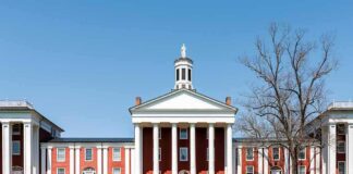 Neoclassical red-brick college building with white columns and cupola