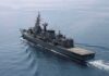 Modern naval warship cruising on calm sea