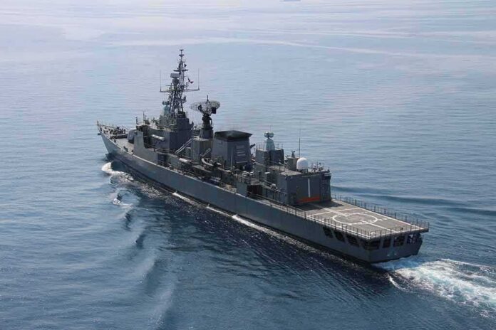 Modern naval warship cruising on calm sea