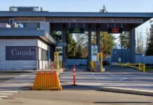 Canada border crossing booths with open and closed lane signs