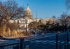 U.S. Capitol building behind security fencing and a quiet street