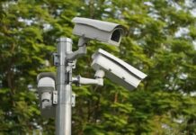 surveillance cameras mounted on a metal pole