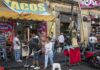 9,746 L.A. Street-Food Complaints Raise Safety Concerns Street taco stand with people and a religious statue