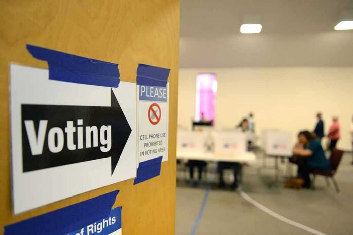 Voting sign on door leading to polling place